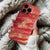 Coque iPhone avec un Motif Marbré en Tons de Rouge et Or